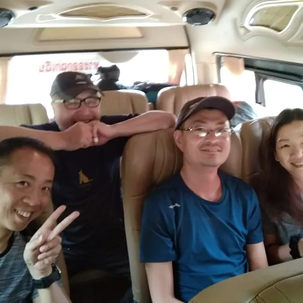 Smiling group of pilots in the tour minivan